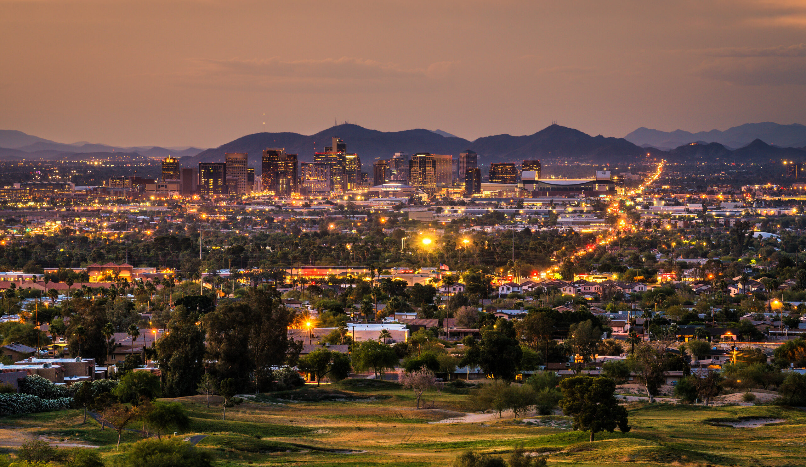 Phoenix Arizona skyline at sunset with Curtis Management & Consulting 